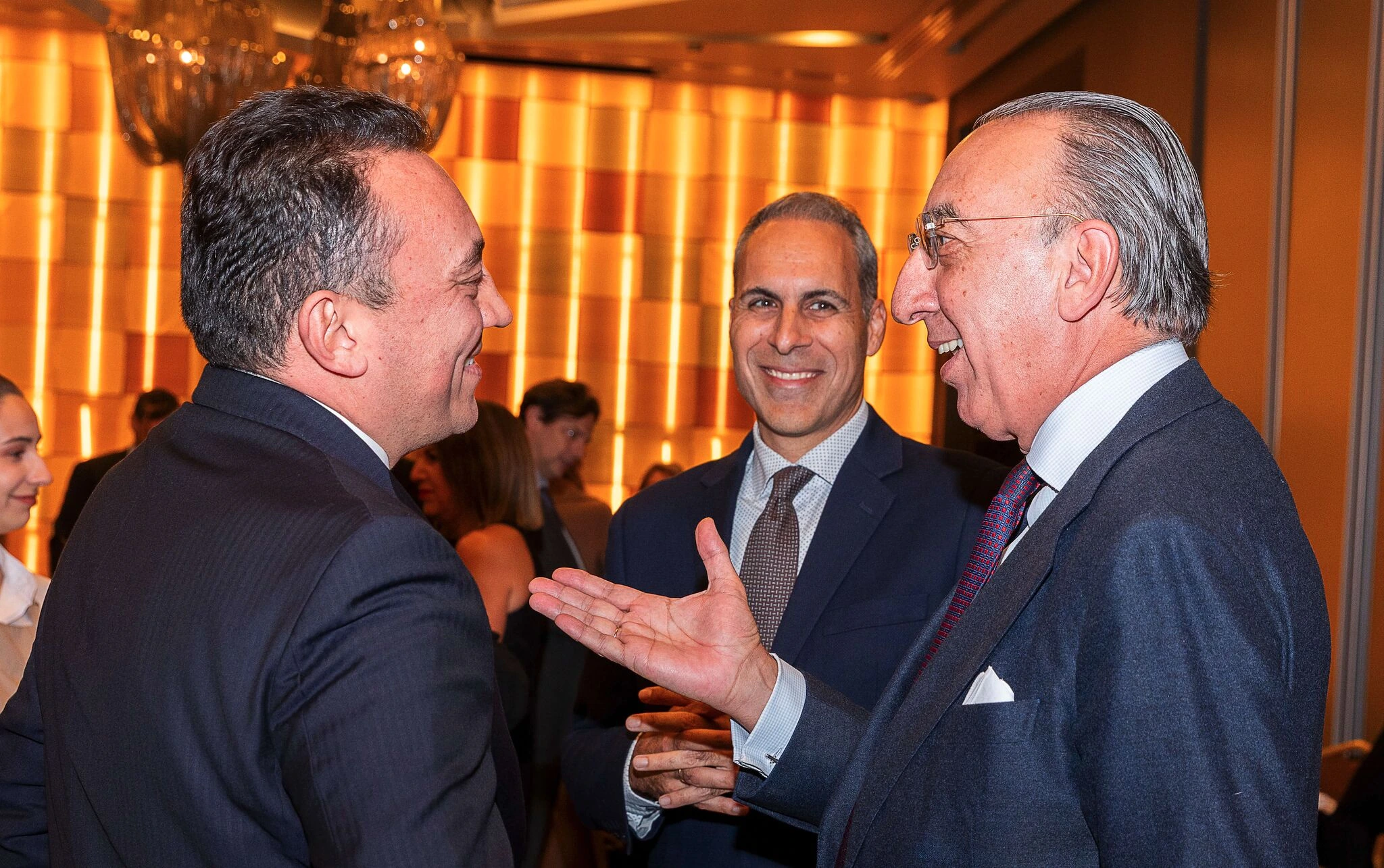 Business representatives in conversation at a Hellenic Spanish Chamber gathering.